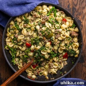 Large pan of orecchiette with sausage and broccoli rabe.