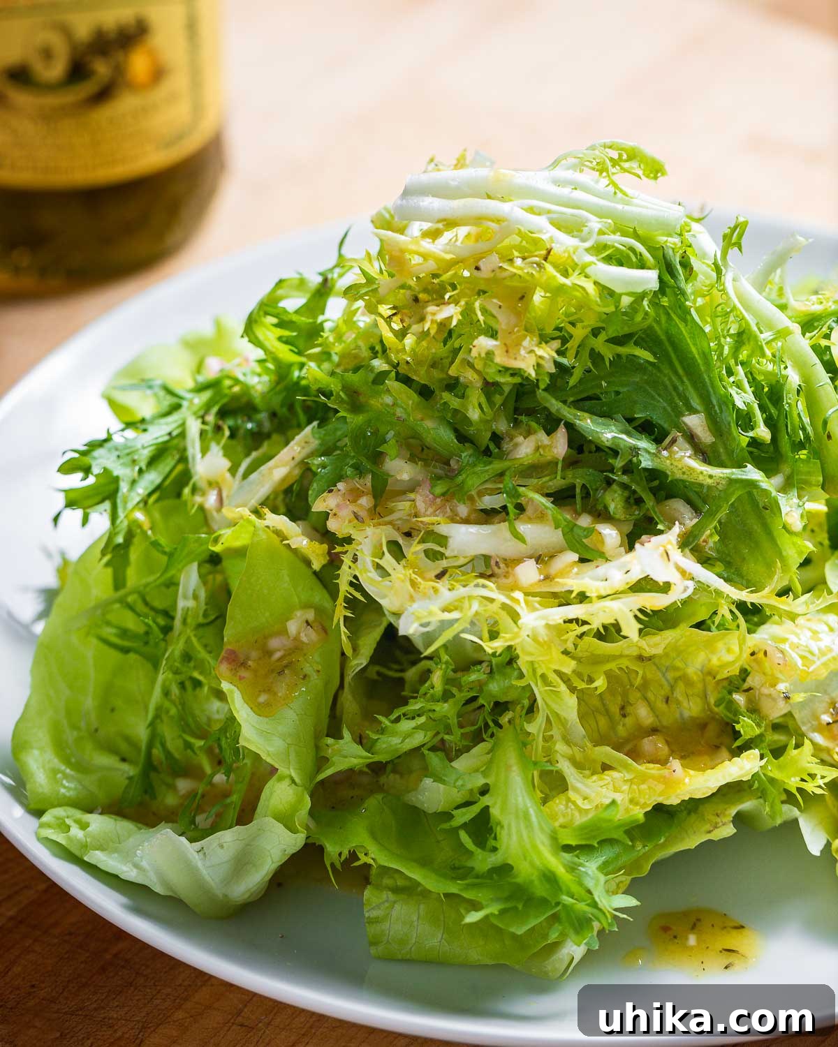 Via Carota House Salad 6 Plate of piled high lettuce greens with vinaigrette.