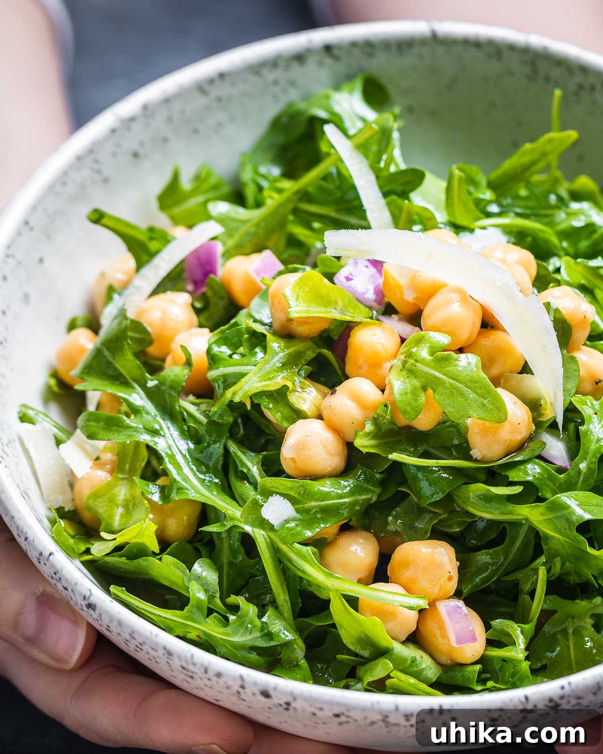 Zesty Lemon Parmesan Chickpea Arugula Salad 2 A vibrant chickpea arugula salad served in an elegant white bowl, ready to be enjoyed.