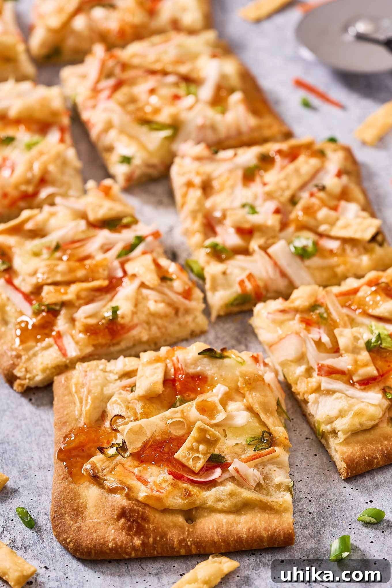 Creamy Crab Rangoon Pizza 2 Crab Rangoon flatbread pizza cut into squares and ready for serving.