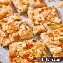 Crab Rangoon flatbread pizza cut into squares and ready for serving.
