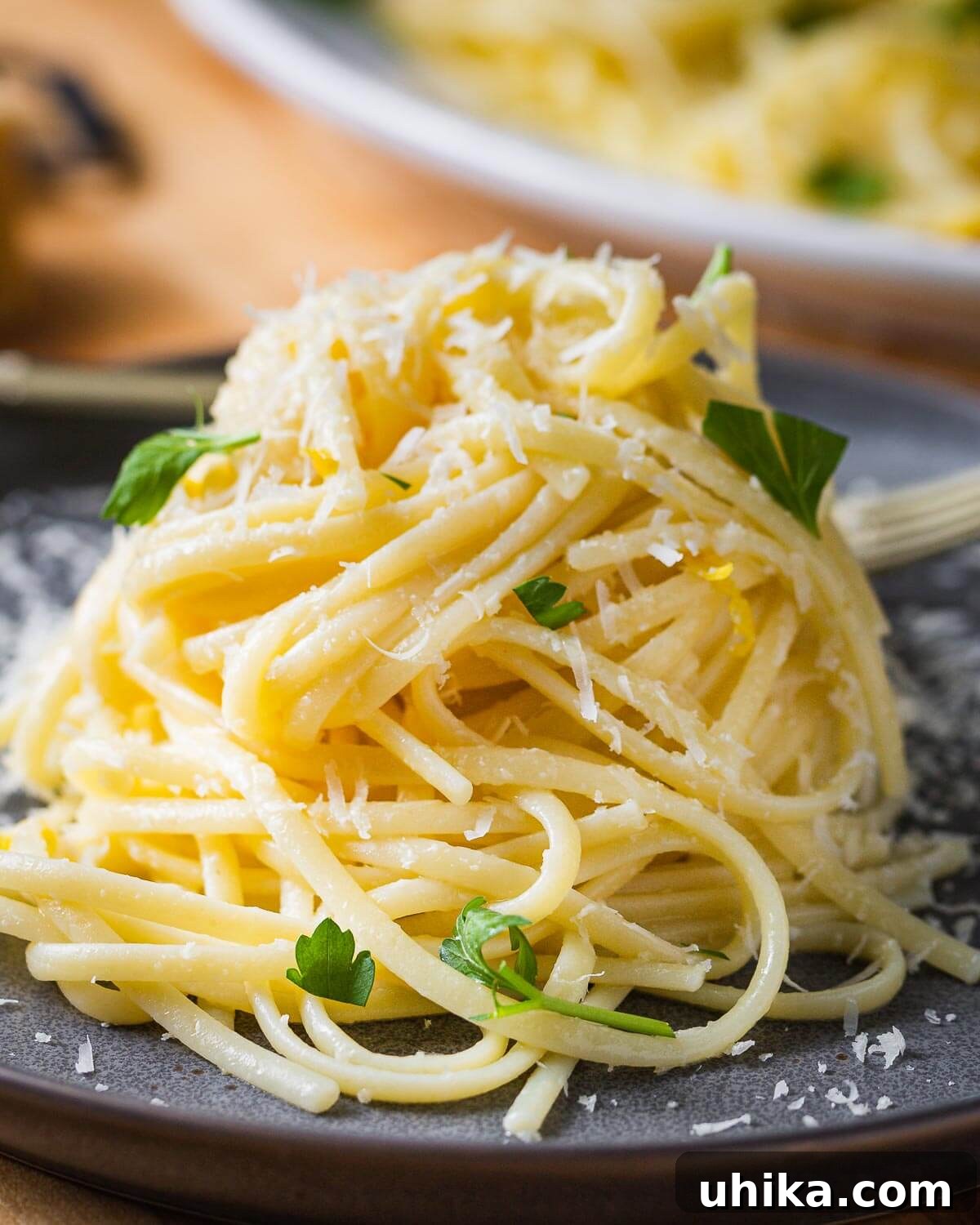 Sunshine Lemon Linguine 2 Close up shot of linguine al limone in plate, garnished with fresh herbs.