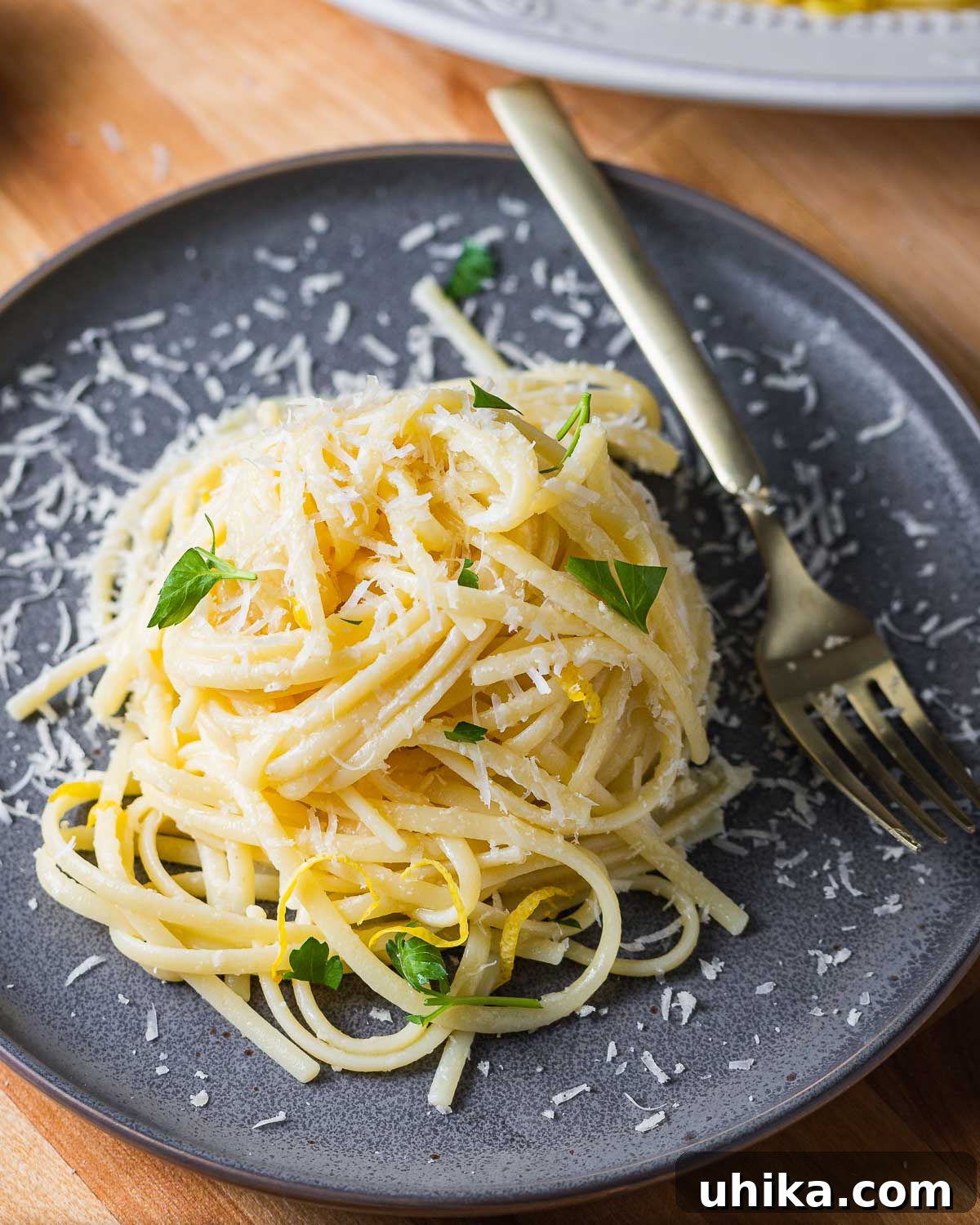Sunshine Lemon Linguine 8 Linguine al limone in grey plate with sprinkled parsley, ready to be served.
