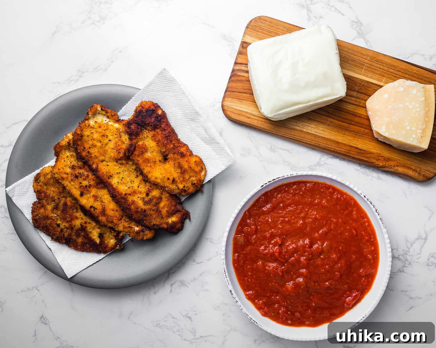 Chicken Parmigiana 3 Ingredients for Chicken Parmigiana: chicken cutlets, fresh mozzarella, grated parmesan, and homemade marinara sauce.