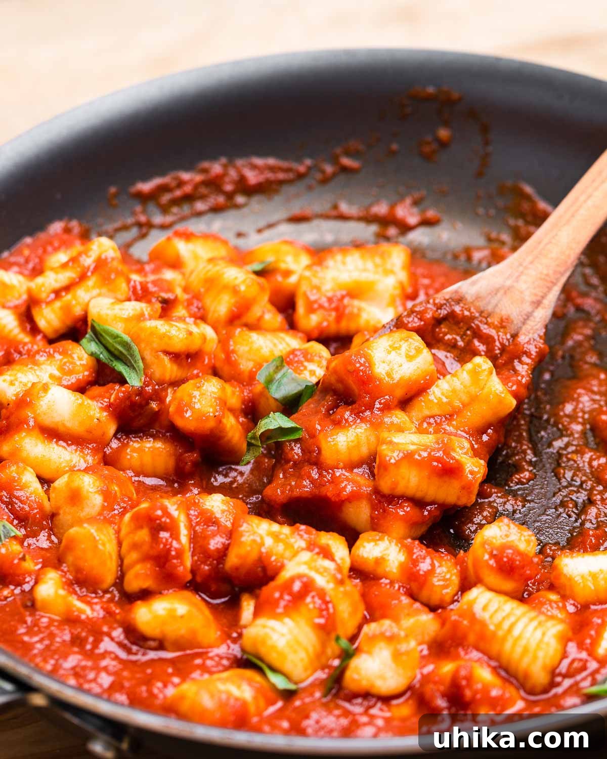 Perfect Potato Pillows 10 Pan of potato gnocchi with tomato sauce.