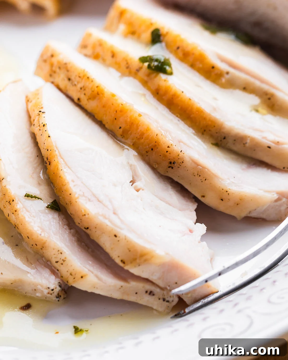 Succulent Dry Brined Turkey Breast 10 Close up shot of sliced turkey breast pieces.