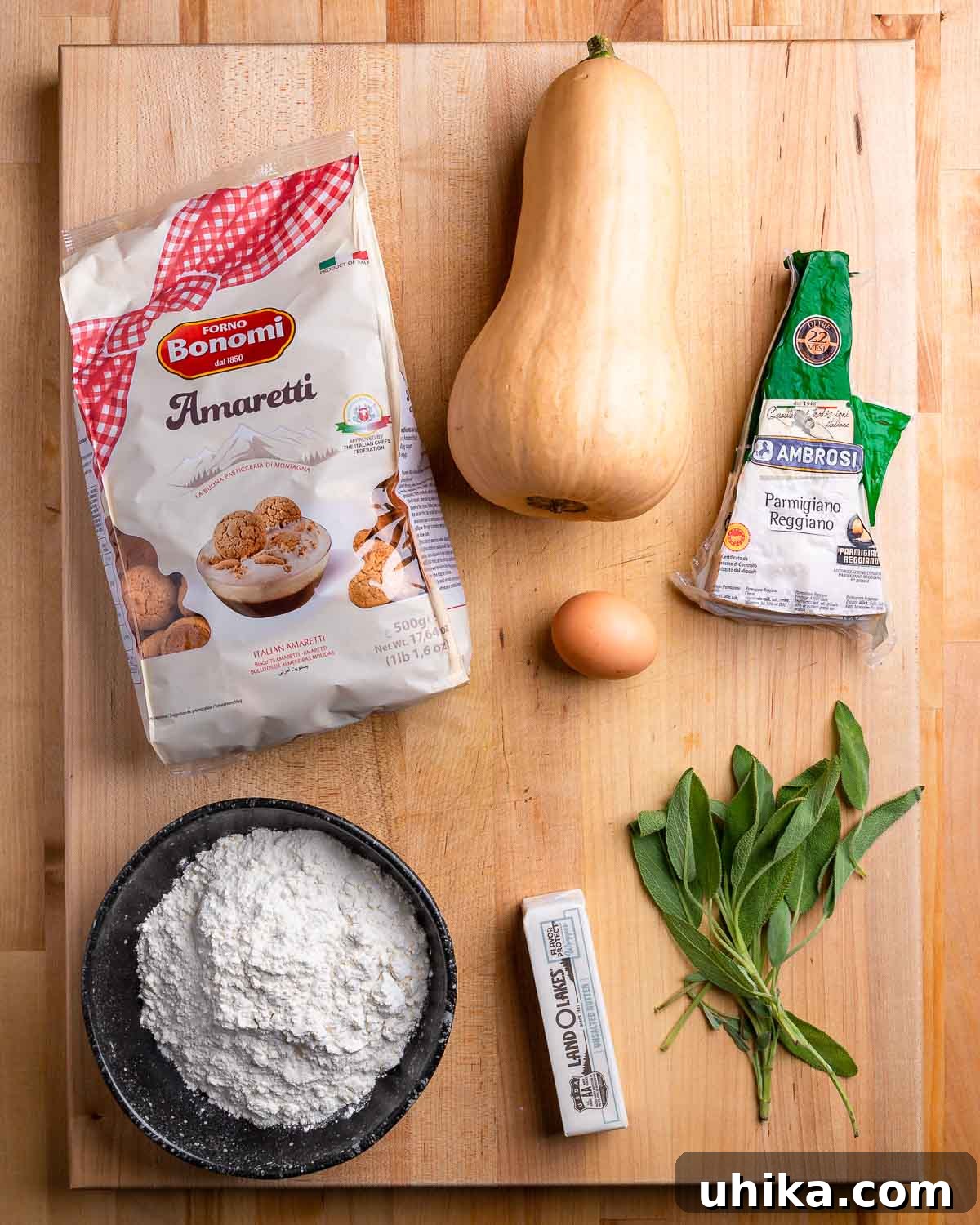Ingredients shown: Amaretti cookie bag, butternut squash, Parmigiano Reggiano, egg, flour, butter, and sage.