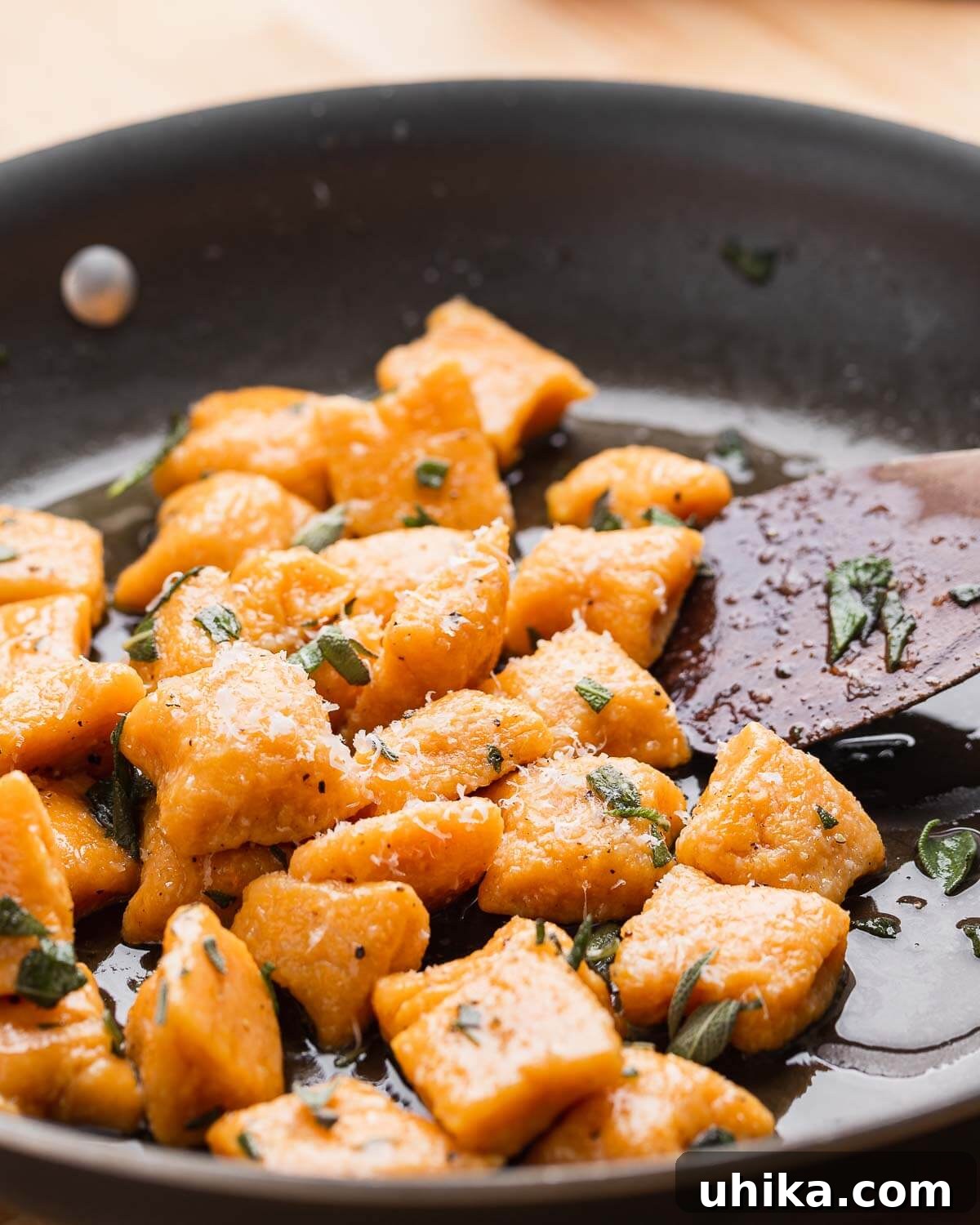 Maple Brown Butter Sweet Potato Gnocchi 9 Large pan filled with sweet potato gnocchi coated in a rich maple brown butter sauce, ready to be served family-style.