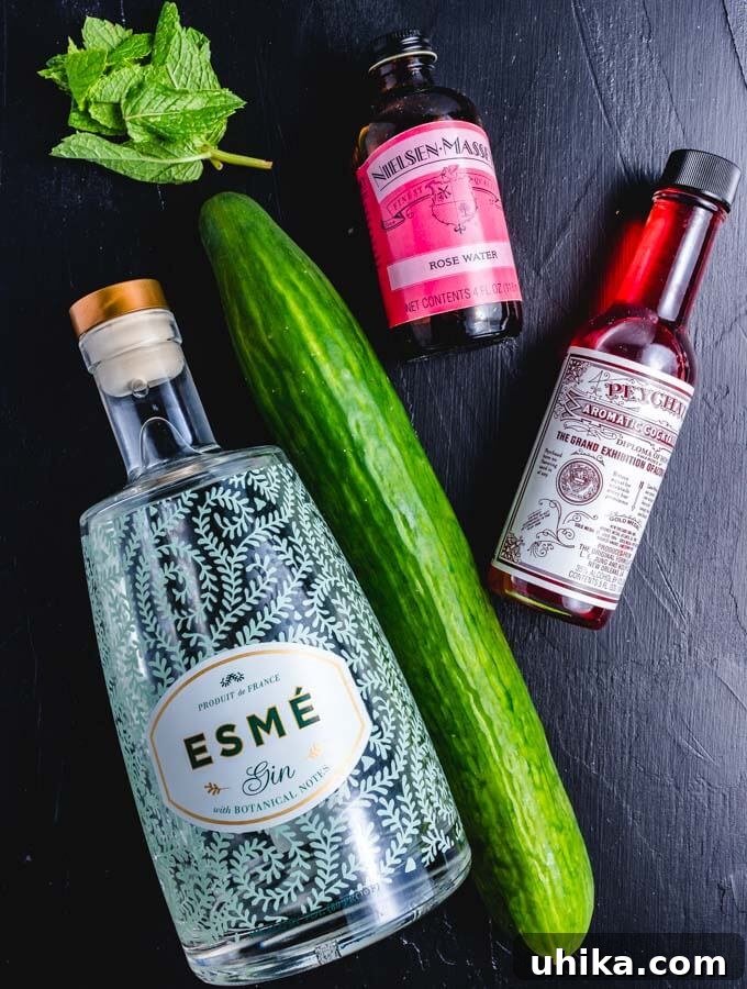 Star-Crossed Elixir 3 Essential ingredients for the Juliet and Romeo cocktail: rosewater, gin, bitters, fresh cucumber, and mint leaves.