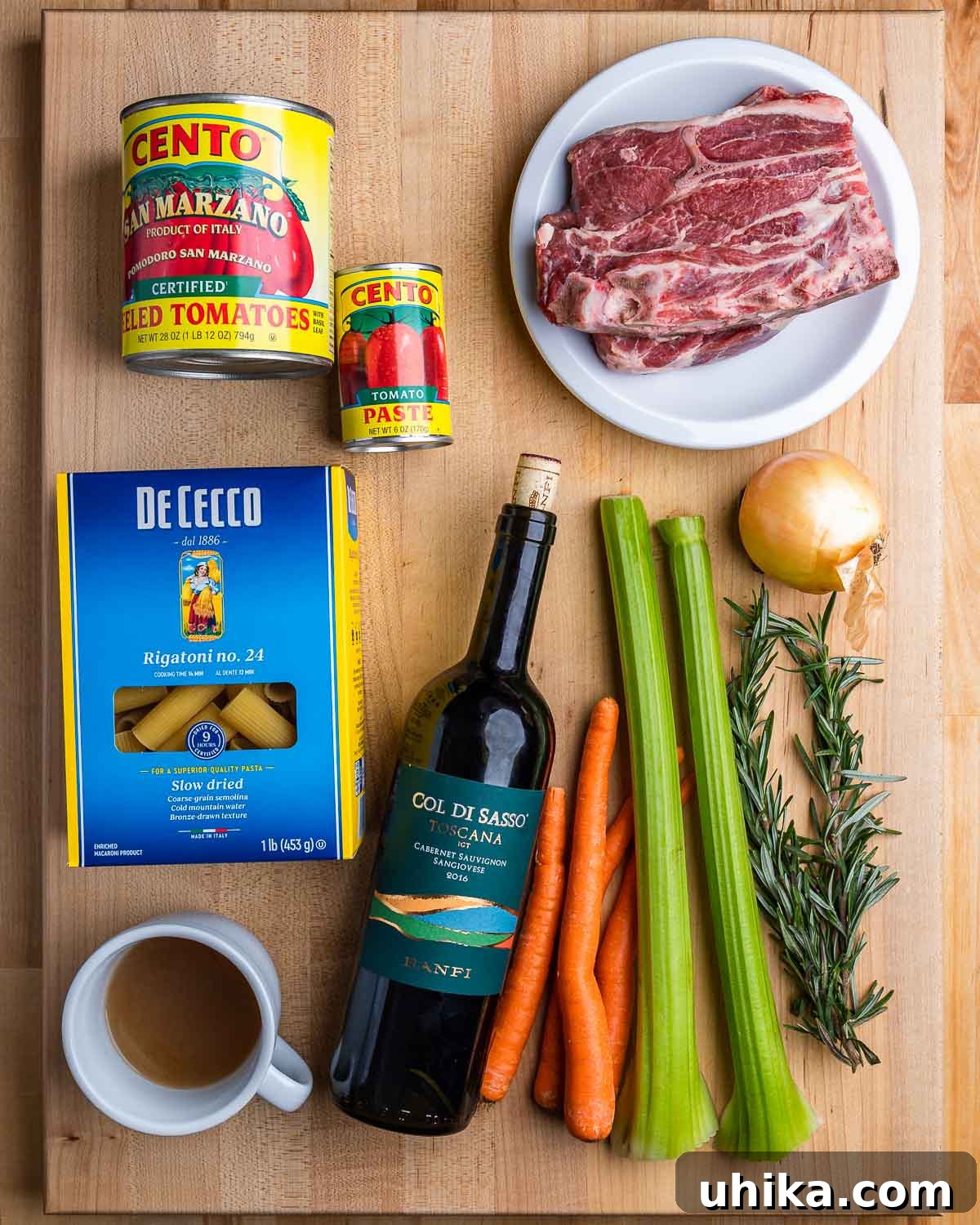 Braised Lamb Ragu with Rigatoni 3 Ingredients for lamb ragu: tomatoes, lamb shoulder, rigatoni, beef stock, red wine, carrots, celery, onion, and fresh rosemary.