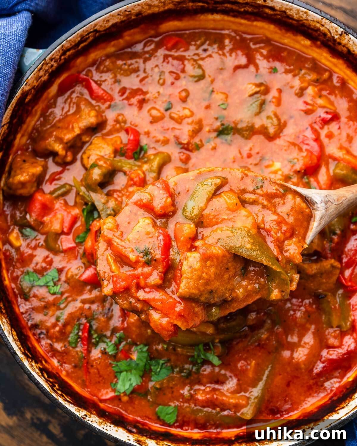 Timeless Veal and Peppers 2 A large pot of Italian-Style Veal and Peppers, featuring tender veal, colorful bell peppers, and a rich tomato sauce.