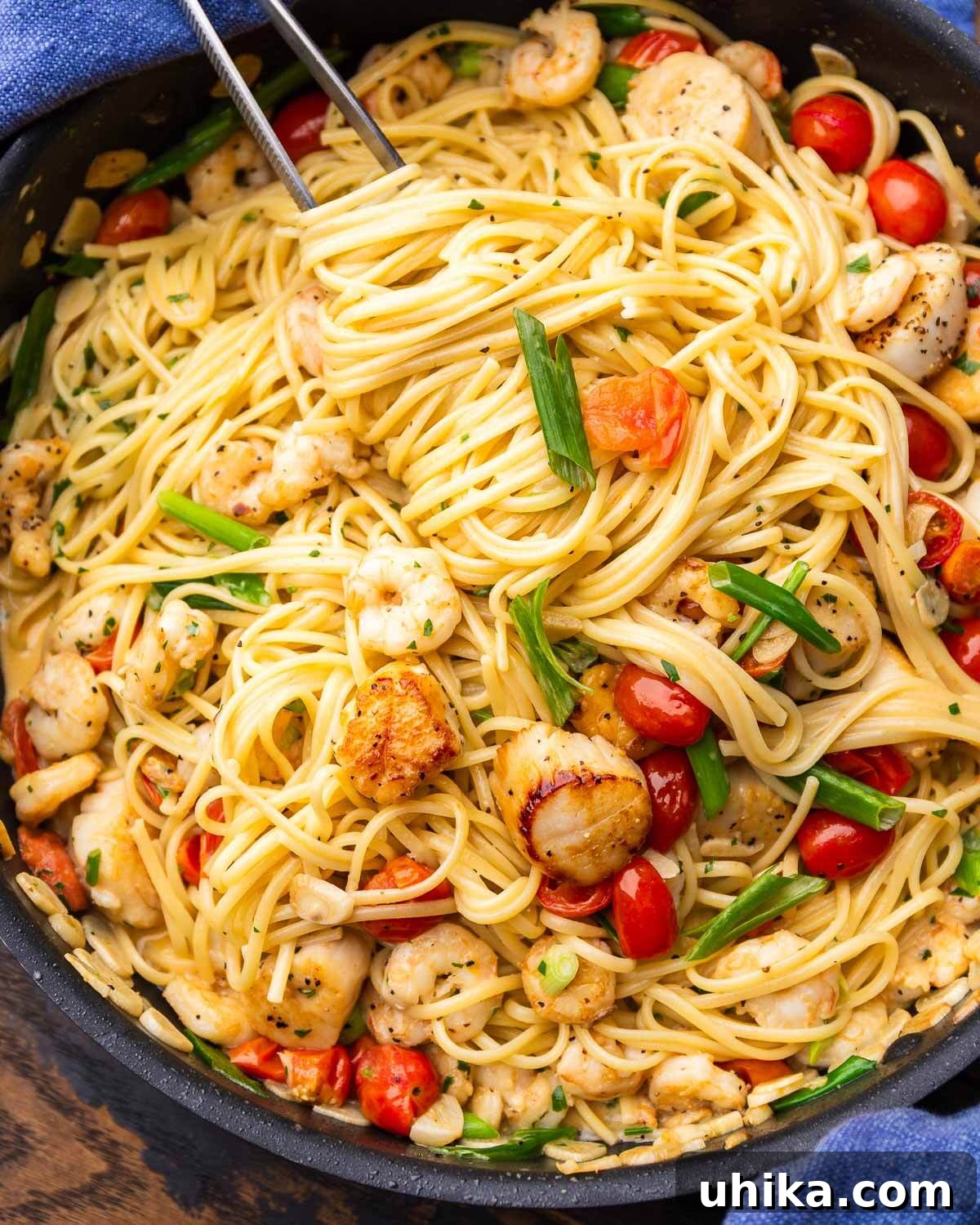 Weeknight Creamy Seafood Pasta 2 Creamy seafood pasta in a sleek black pan, ready to be served.