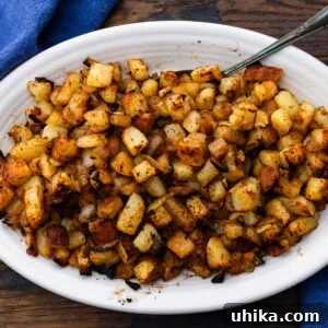Steakhouse Skillet Potatoes 7 Steakhouse homefries in white platter.