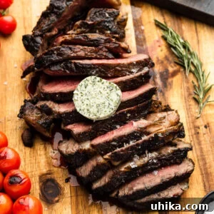 Tomahawk Steak: Grill It Like a Pro 8 Sliced grilled tomahawk steak topped with compound butter.