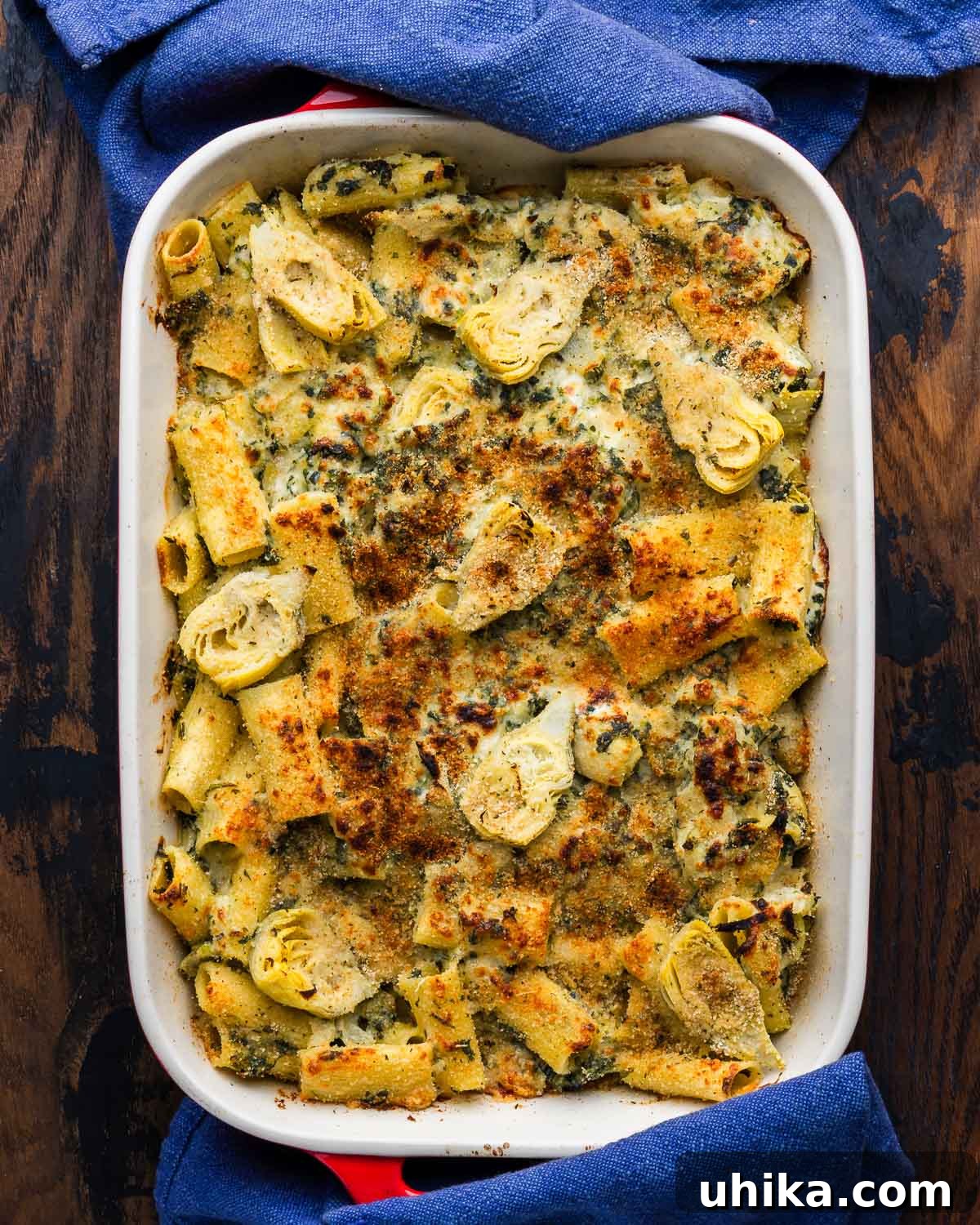 Creamy Baked Spinach and Artichoke Pasta Casserole 2 Baked artichoke and spinach pasta in large baking dish.