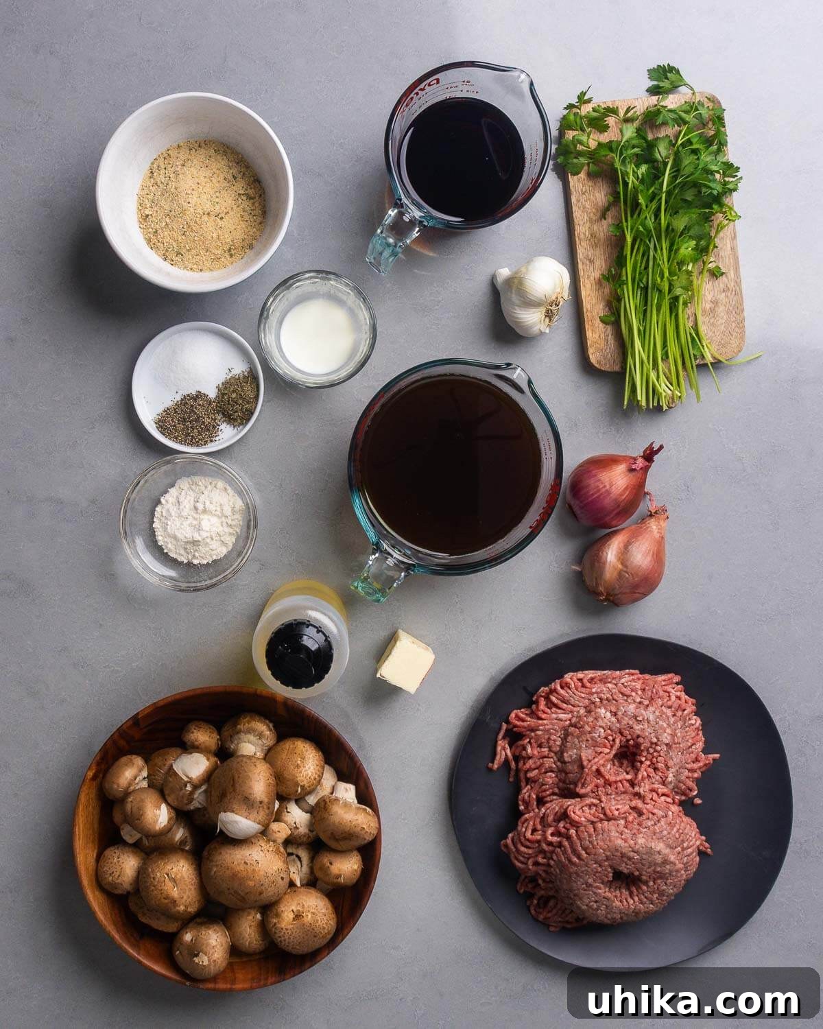 Marsala Meatballs with Creamy Mushroom Sauce 4 Ingredients shown: breadcrumbs, salt, pepper, thyme, marsala wine, garlic, parsley, flour, olive oil, butter, beef stock, shallots, mushrooms, and ground chuck.