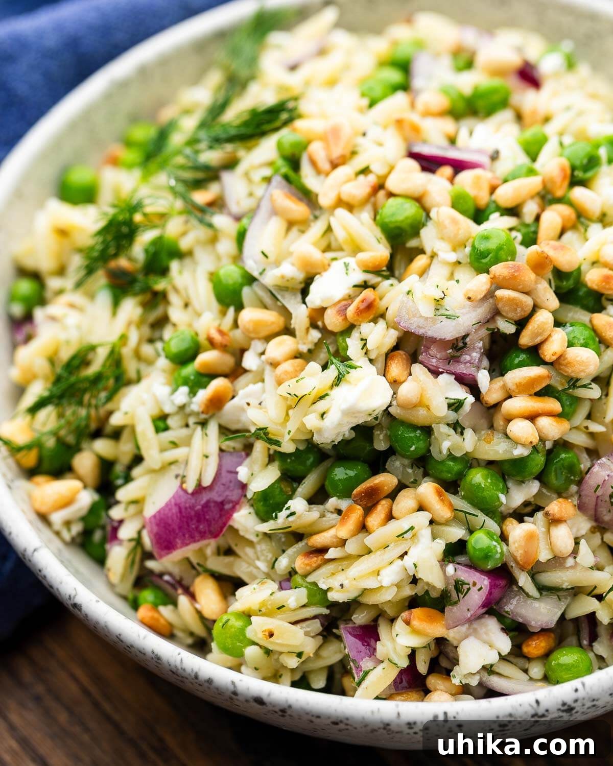Lemon Herb Orzo Salad — Fresh Summer Side Dish 2 White bowl with lemon herb orzo salad.