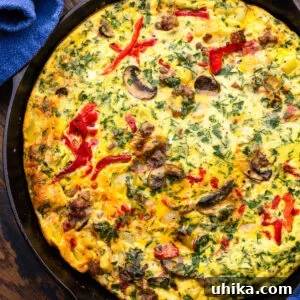 Sausage and Mushroom Frittata Recipe for Busy Weeknights 7 Sausage, mushroom, and roasted red pepper frittata in cast iron pan.