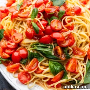 Fresh No-Cook Tomato Sauce Recipe — Perfect Summer Pasta Topping 6 Linguine with uncooked tomato sauce.