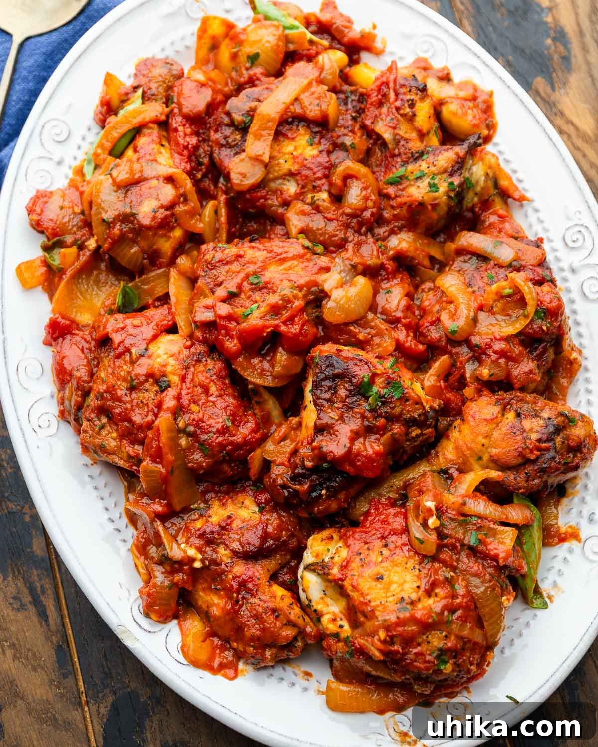 Pollo alla Potentina: Spicy Italian Braised Chicken with Tomatoes 2 White platter with pollo alla potentina.