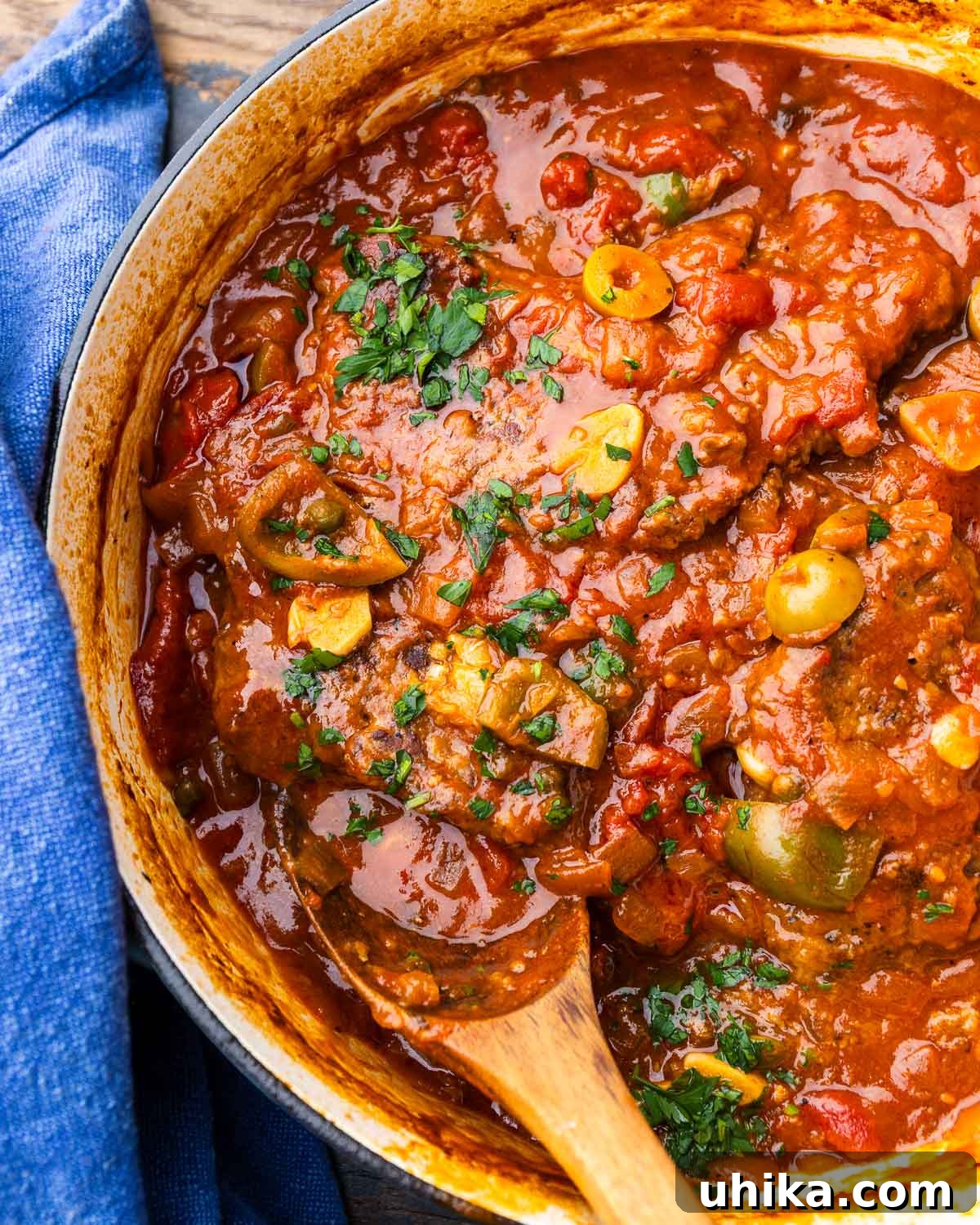 Mediterranean Braised Steak with Capers, Olives and Peppers 2 Large pot with braised steak, capers, olives, and cherry peppers.