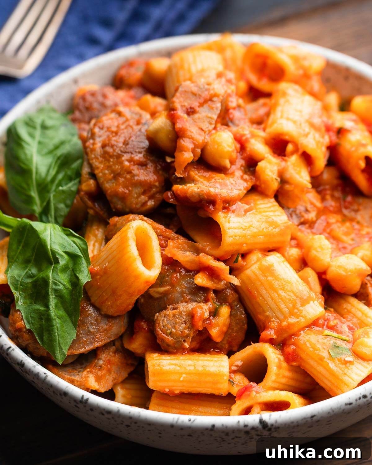 One-Pot Sausage and Chickpea Pasta 2 Bowl of sausage chickpea rigatoni.